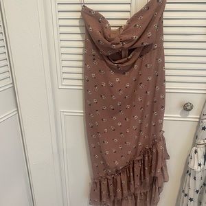 Cut out dress with asymmetrical bottom.